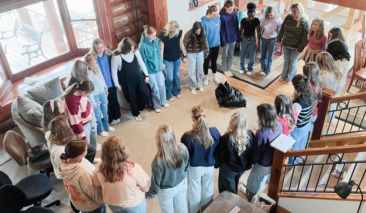 Youth and adult leaders gathered together in prayer